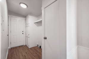 Laundry room featuring light hardwood / wood-style flooring