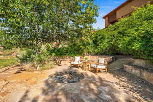 View of patio featuring an outdoor fire pit