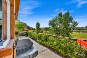 View of patio featuring a mountain view and area for grilling