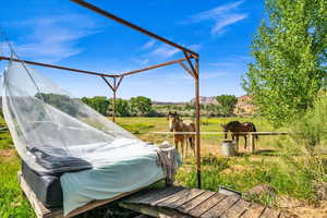 Deck with a rural view and an outdoor structure