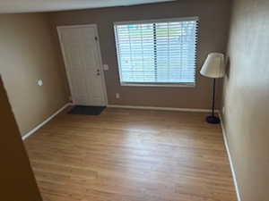 Featuring light laminate flooring