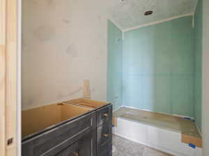 Bathroom featuring a bathtub and vanity