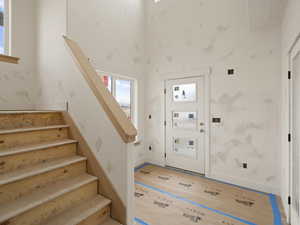 Foyer with a towering ceiling