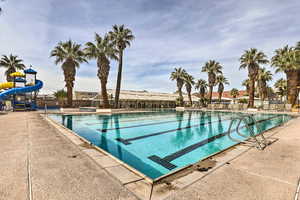 View of pool featuring a patio area and a water slide