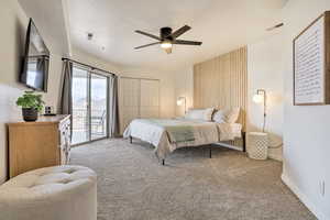 Carpeted bedroom with access to exterior, a textured ceiling, a closet, and ceiling fan