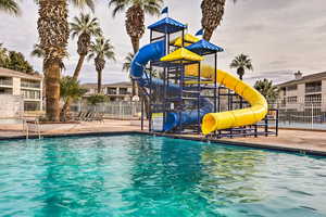 View of pool with a water slide