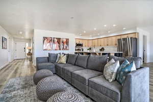 Living room featuring light hardwood / wood-style flooring and sink