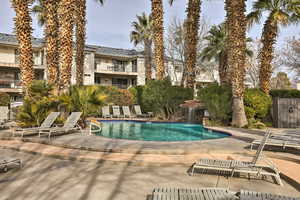 View of pool featuring pool water feature and a patio area