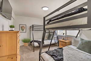 Carpeted bedroom with a textured ceiling