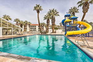 View of swimming pool featuring a water slide