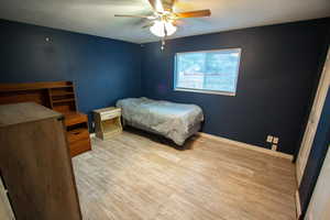 Bedroom featuring ceiling fan and light hardwood / wood-style floors