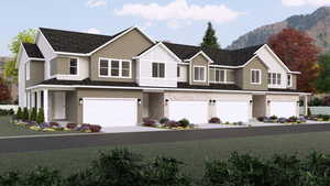 View of front facade with a mountain view and a garage