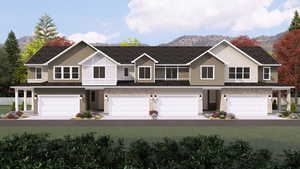 View of front of house featuring a mountain view and a garage