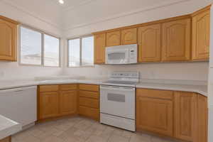 Kitchen with white appliances and sink