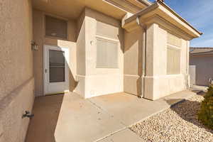 Entrance to property featuring a patio