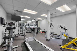 Exercise room featuring a drop ceiling