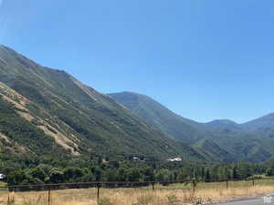 Property view of mountains with a rural view