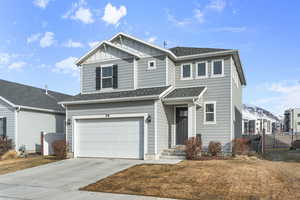 View of front of home featuring a garage