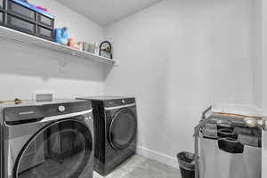 Clothes washing area with washing machine and clothes dryer