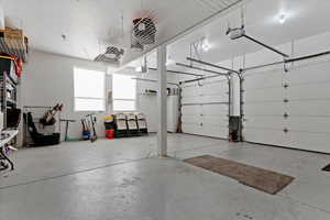 Garage featuring a garage door opener