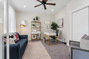 Home office featuring carpet floors and ceiling fan