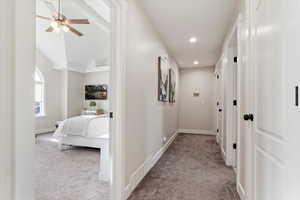 Hall with light colored carpet