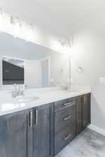 Bathroom with tile patterned flooring and vanity