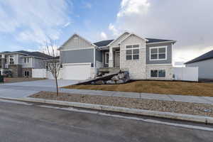 View of front of property featuring a garage