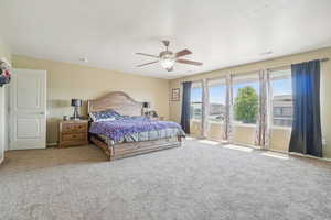 Bedroom with carpet and ceiling fan