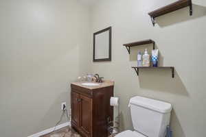 Bathroom featuring vanity and toilet