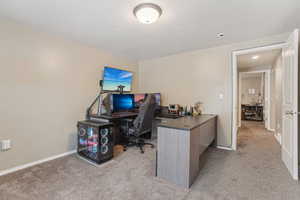 View of carpeted home office