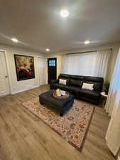 Living room with hardwood / wood-style floors