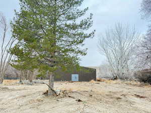 View of yard featuring an outbuilding and a pole building