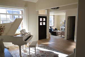 Foyer featuring a wealth of natural light and light hardwood / wood-style flooring