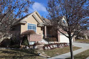 View of front of property featuring a garage