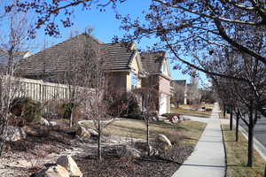 View of property exterior featuring a garage