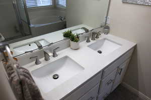 Bathroom with vanity and a bathtub