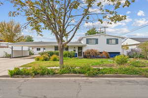 Tri-level home with view of the landscaping, photo taken in Oct