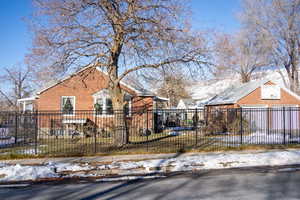 Bungalow-style home with a lawn