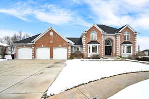 View of front facade featuring a garage