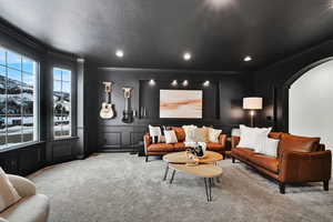 Carpeted Living room with crown molding