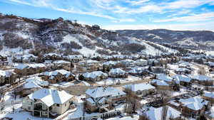 Snowy aerial view featuring a mountain view