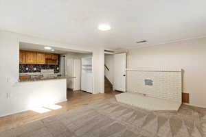 Unfurnished living room with light hardwood / wood-style floors