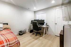 Bedroom 6 - Home office featuring light hardwood / wood-style floors