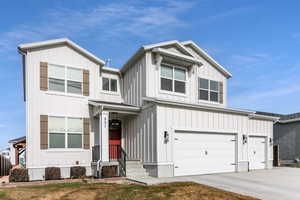 View of front of home featuring a garage