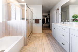 Primary bathroom with vanity and independent shower and bath