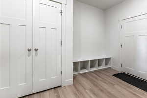 Mudroom featuring light wood-type flooring