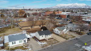 Snowy aerial view with a mountain view