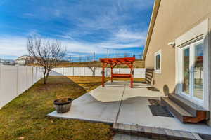 View of yard featuring a pergola and a patio