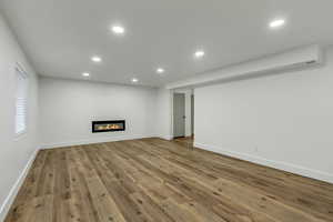 Unfurnished living room with hardwood / wood-style floors